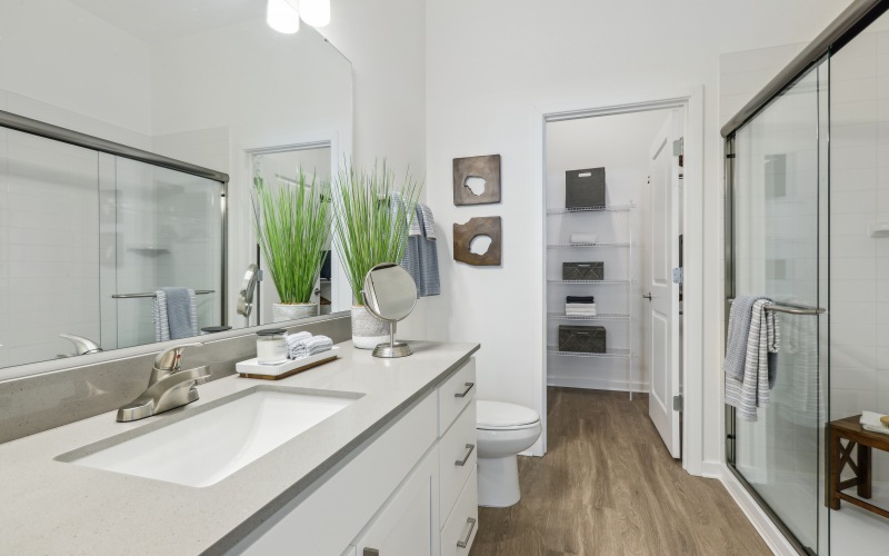 Luxury glass showers and walk-in closets in home bathrooms at The Tides at Waterside