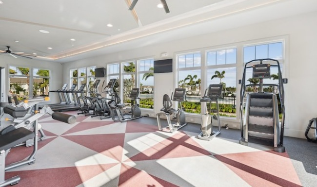 Ample cardio equipment in The Tides at Waterside's fitness center for residents  use